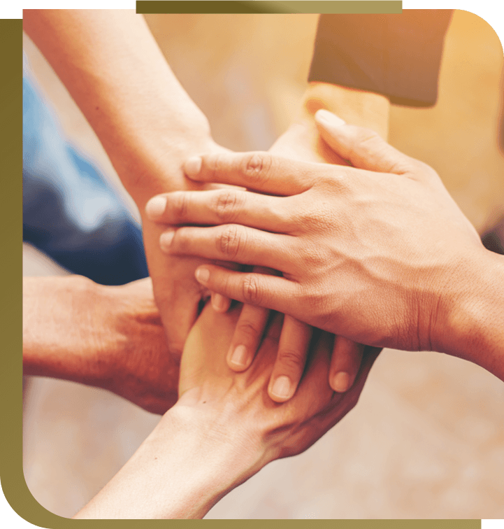 Four hands overlapping each other, representing union and teamwork